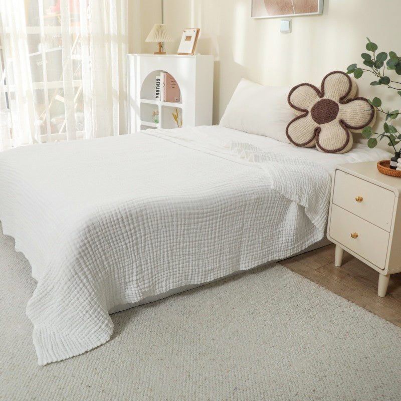 Plaid L'Aérien blanc sur un lit